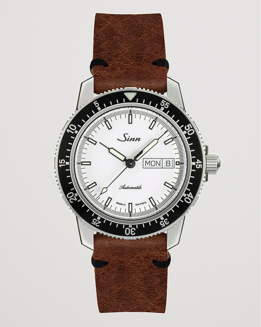 Brown strap white face shop watch