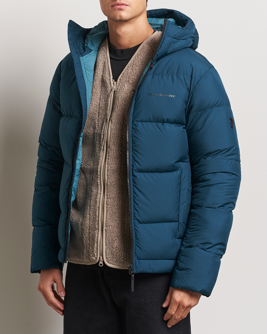 Herr |  | Peak Performance | Rivel Down Hooded Jacket Ininity Teel